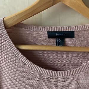 Long-sleeve crew neck knit sweater.
